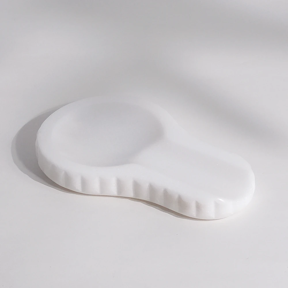 White marble spoon rest with wave edge